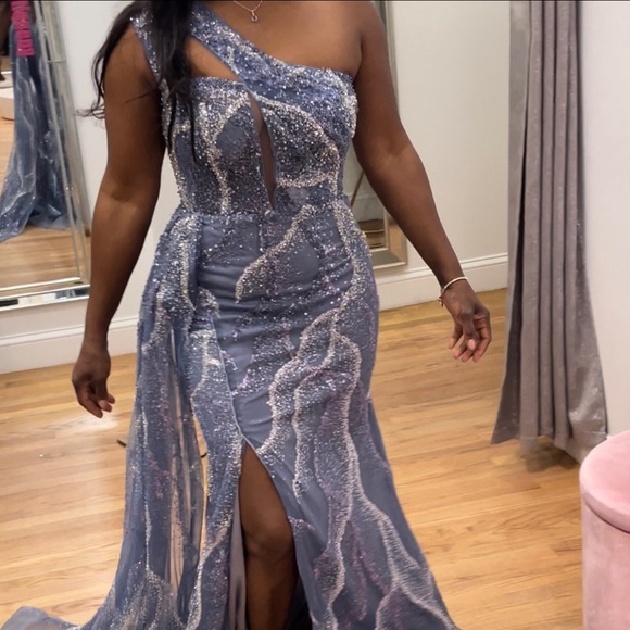 This is a beautiful one-shoulder sleeve beaded dress that fits beautifully. - Picture 2 of 2